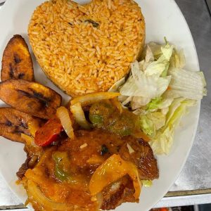 Jollof Rice, Stewed Meat, Plantains and Salad
