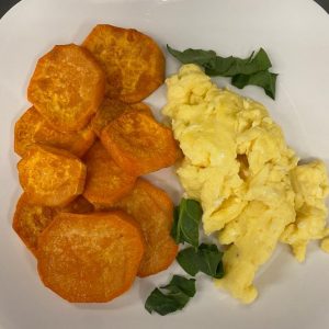 Fried Sweet Potatoes And Scrambled Egg With Orange Juice